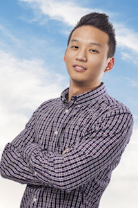 portrait of handsome young asian man over sky background